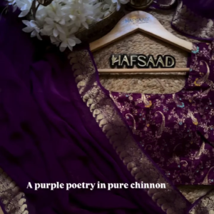A pure chinnon purple jacquard and embroidery saree is a stunning choice for traditional and festive occasions
